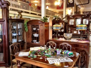 Old dining table in front on china cabinets