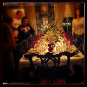 An elegant table setting lit with candlelight.