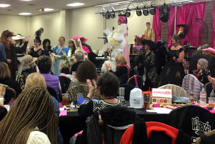 a room full of ladies with antique clothes on