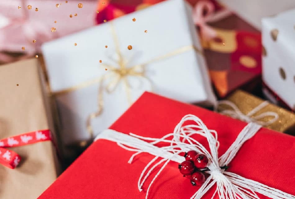 gift boxes wrapped in white, red, and tan