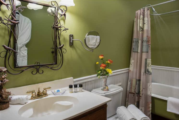 white vanity with bath amenity bottles on top