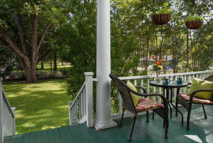 back porch with chairs and table