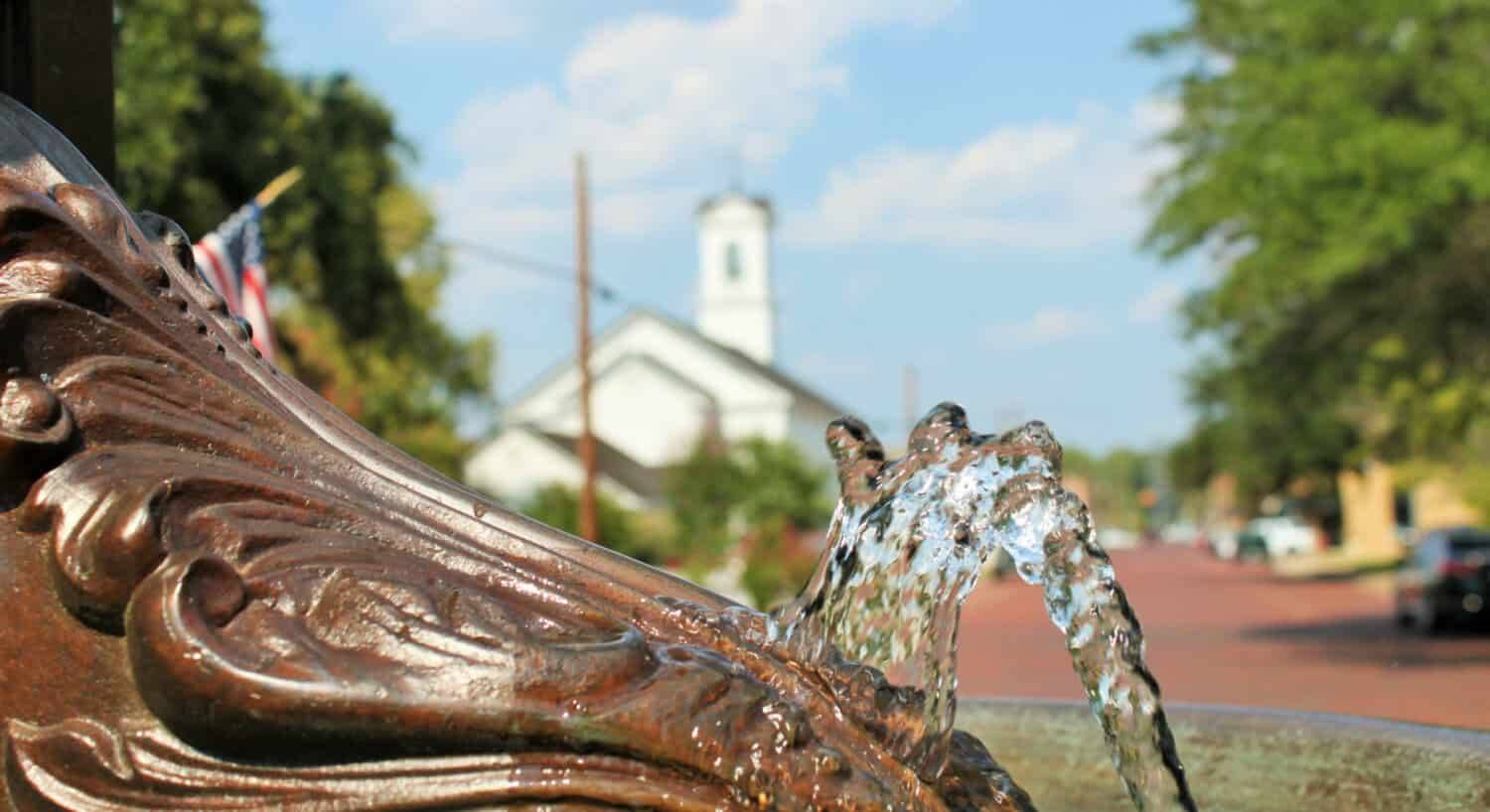 Close up view of a bronze water fountain