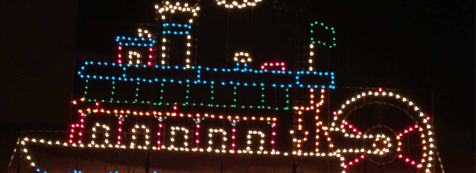 a steamboat metal frame with christmas lights